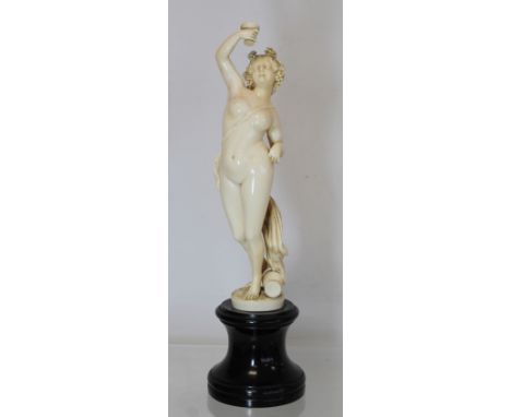 19th century European carved ivory figure of a bacchanalian female deity, probably Libera, with wine goblet, fruiting vine ga