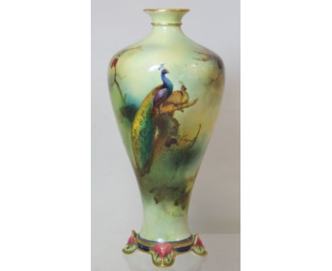 Royal Worcester James Hadley porcelain vase of baluster form on four scroll feet decorated with peacocks in polychrome enamel