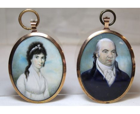 A pair of Georgian portrait miniatures of a husband and wife, each watercolour on ivory, 8cm x 6cm (oval) in gilt metal frame