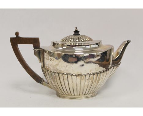 Silver tea pot, oval part fluted, by E. Hutton 1885, 18 oz / 500g.