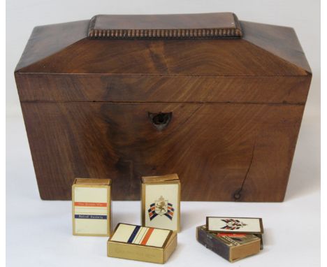 Early 19th century mahogany tea caddy of sarcophagus form (lacking escutcheon and ball feet), with relined interior, 23cm lon
