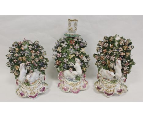 18th century Chelsea porcelain three piece rabbit candlestick garniture, each with large bocage back and two rabbits on C scr