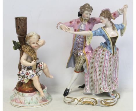 19th century Sitzendorf porcelain candlestick depicting Autumn in the form of a cherub holding a sheaf of wheat on naturalist