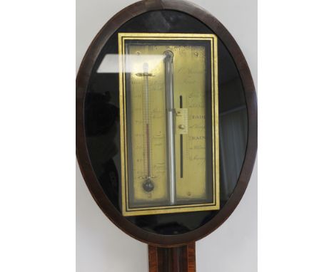 Unusual early 19th century stick barometer by C. Aiano London, the brass scale within an oval bezel with black and gilt frame
