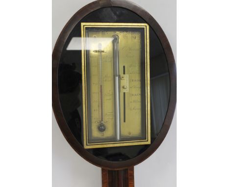 Unusual early 19th century stick barometer by C. Aiano London, the brass scale within an oval bezel with black and gilt frame