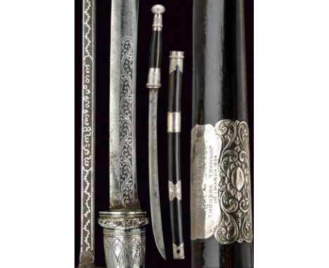 dating: 1934 provenance: Burma, Curved, single-edged blade, with fuller, inlaid with silver rinceaux at the forte on both fac