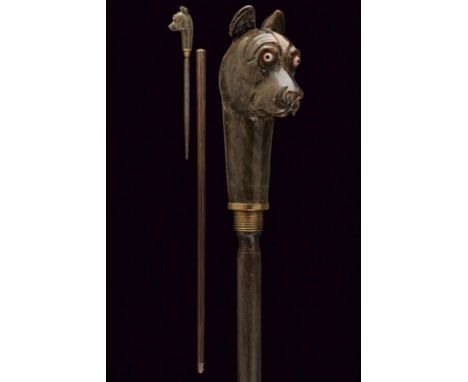 dating: Late 19th Century provenance: Europe, Wooden grip, embossed with in-the-round dog's head, with glass eyes. Grip can b