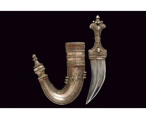 dating: circa 1900 provenance: Oman, Curved, flat, double-edged blade, with central raiser. Silver grip, decorated with frame