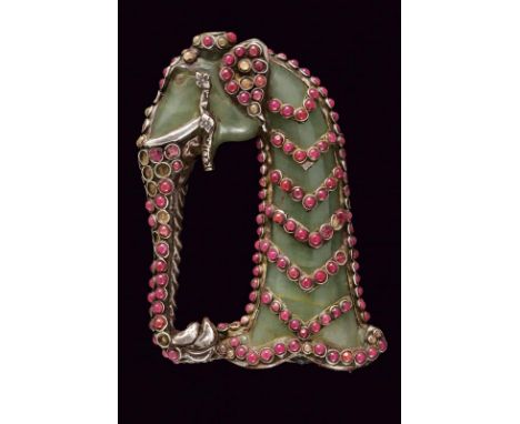 dating: 19th Century provenance: India, In green jade, with pommel shaped as elephant's head, trunk makes the loop-guard. Ric