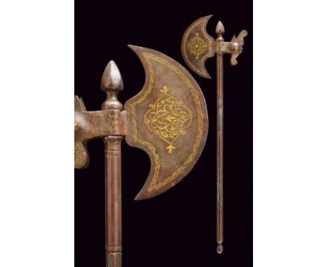 dating: Late 19th Century provenance: India, In iron. Round-edged axe, handle shaped as stylized bird's head, golden floral a