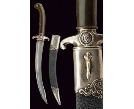 dating: 19th Century provenance: France, Curved, single-and false-edged blade (in damask?), small tang. Horn grip with silver