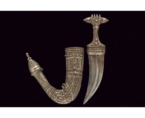 dating: circa 1900 provenance: Oman, Curved, double-edged blade, with central raiser. Silver grip, richly decorated with fili