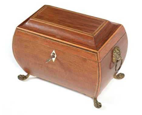 A Regency partridge wood tea caddy, of bombe form, the hinged and boxwood lined lid, enclosing a vacant interior, with brass 