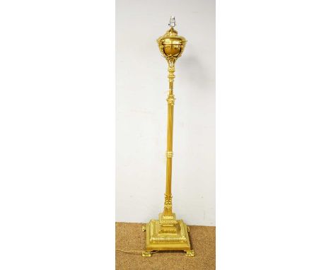 A 20th Century brass telescopic oil lamp converted for electricity, with central brass reservoir, raised on a fluted adjustab