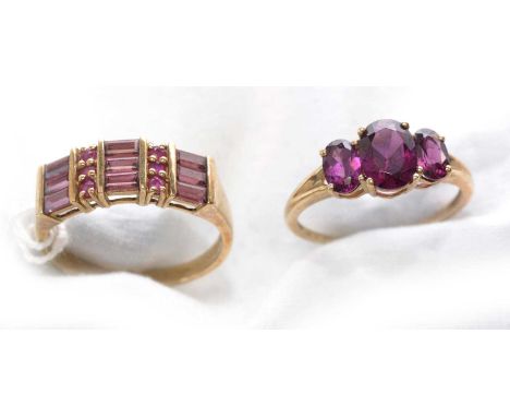 A garnet and ruby ring, set with rectangular step-cut garnets and circular facet-cut rubies, on 9ct. yellow gold shank, ring 