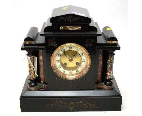 A French black slate and marble mantel clock, circa 1900, of architectural form.