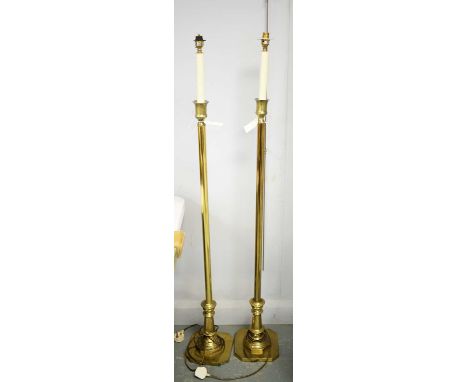 A pair of brass lamp standard.