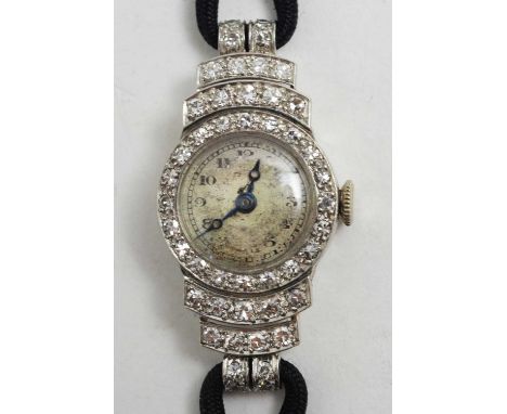 Diamond cocktail watch, by Vertex, the arabic dial fitted manual wind movement in platinum case with stepped shoulders set ei
