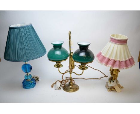 Brass two branch table lamp, with blue glass shades, 45cm high; a gilt ceramic candlestick with later lamp mount modelled as 