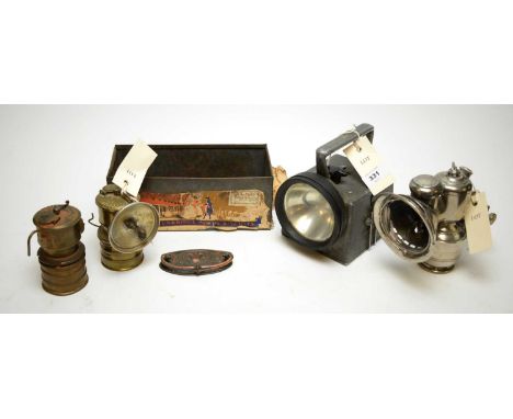 A Lucas Acata Number 316 bicycle lamp; two British made premier carbide Miner's lamps; a British Rail Bardick Ltd patent 1042