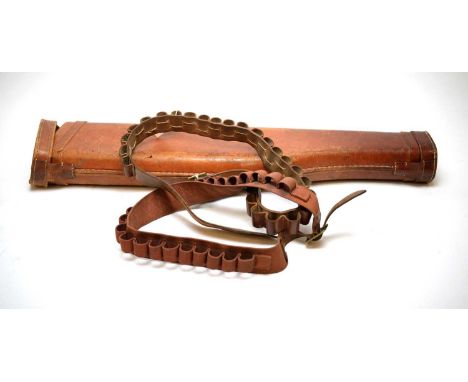 A vintage shoulder o' mutton leather gun case; and a leather cartridge belt.