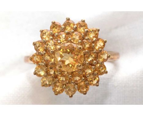 A citrine cluster ring, set with graduated circular facet-cut citrines, on 9ct. yellow gold shank, ring size Q, 3.4grms gross