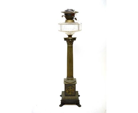 A corinthian column form oil lamp base with glass reservor (no shade or shoot).