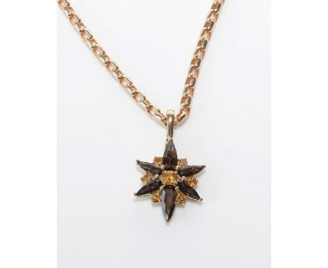 A smokey quartz and citrine pendant, set with seven circular facet-cut citrines interspersing six elongated pear-cut smokey q