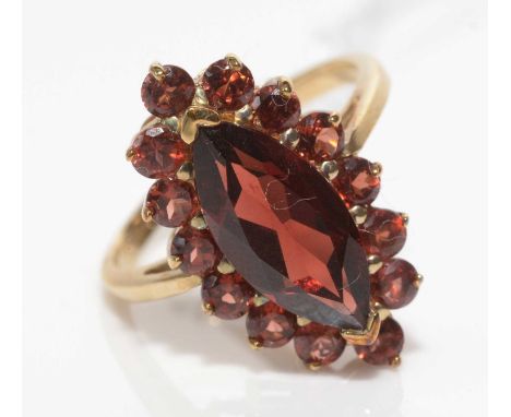 A garnet cluster ring, the principal marquise-cut garnet surrounded by fourteen circular facet-cut garnets in a cluster mount