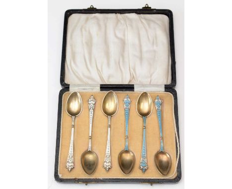 Six Norwegian silver gold enamel coffee spoons, three decorated in white and three in blue and white, in fitted case.