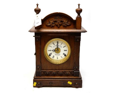A late 19th Century oak cased mantel clock with enamelled Roman dial, signed Fattourini &amp; sons, patent automatic alarm, B