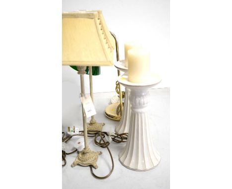 A pair of table lamps; another table lamp; and a pair of pottery candle stands.