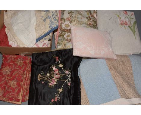 A mixed selection of fabrics, including: a quantity of lily patterned fabric; patchwork quilt; floral decorated curtains; lin