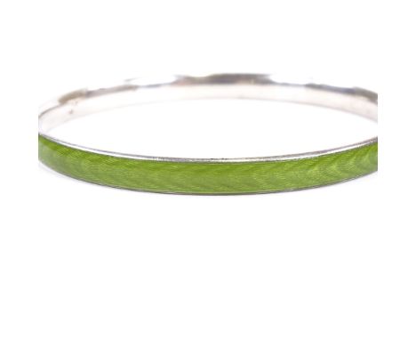 A Danish sterling silver and green enamel slave bangle, maker's mark HEF ?, band width 5.8mm, internal diameter 63mm, 22g

Go