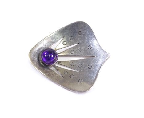 HUGO GRUN - a Vintage Danish sterling silver and cabochon amethyst stylised meteorite brooch, engraved and pierced settings, 