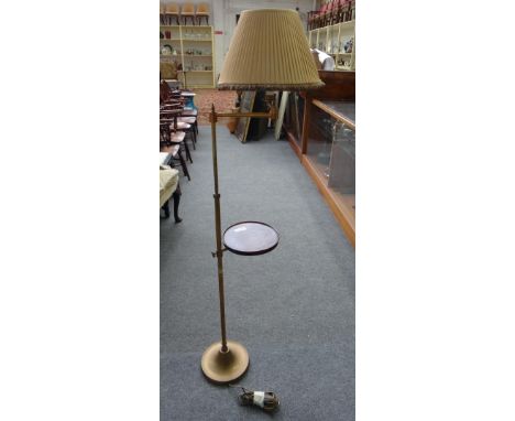 A Victorian style brass and mahogany mounted adjustable standard lamp with plated shade and adjustable circular mahogany tray