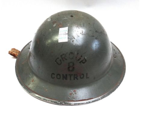 Military interest; a World War II 'Group B Control' helmet (Wales & Cardiff), another similar helmet, an S.C. Police helmet, 