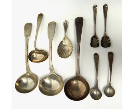 Silver flatware, comprising; two fiddle pattern and one Old English pattern sauce ladle, a caddy spoon, with a scallop shell 