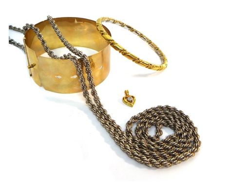 A gold circular bangle, detailed 9 CT, a gold plated bangle, a gold plated and colourless gem set small heart shaped pendant 
