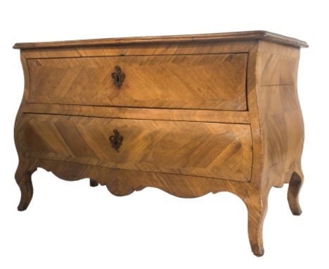 A 18th century North European walnut bombe two drawer commode on cabriole supports, 126cm wide.   Illustrated
