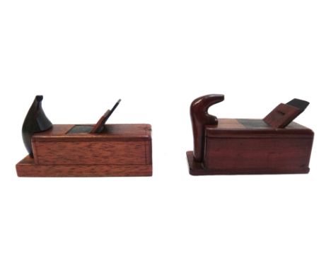 A mahogany novelty snuff box, 20th century, carved as a woodblock plane and another similar snuff box, 8.5cm (2). 