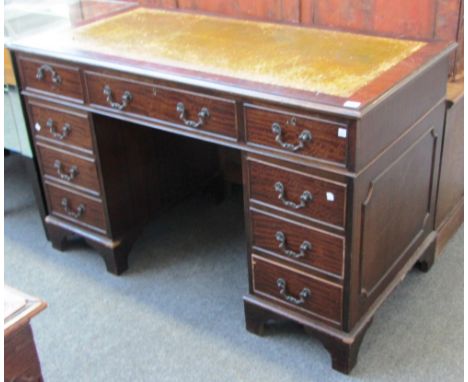 An 18th century style mahogany nine drawer pedestal desk on bracket feet, 122cm wide. 