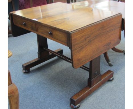 A William IV rosewood two drawer sofa table on trestle end standards, 90cm wide.