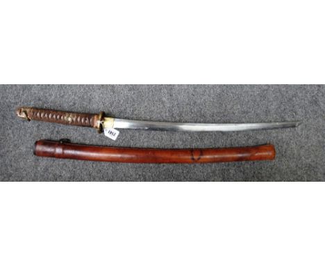 A Japanese Wakazashi sword with steel curved blade (64 cm), unsigned tang, shin-gunto mounts and a leather bound scabbard. 