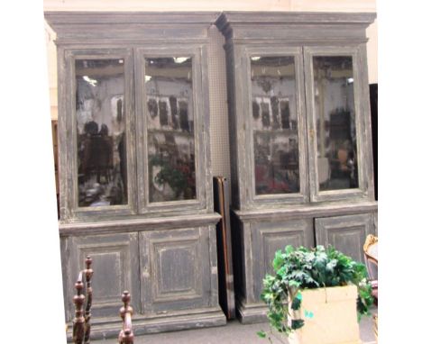 A large pair of 19th century French grey painted bookcase cupboards, each with pair of glazed doors over panel cupboards, 166