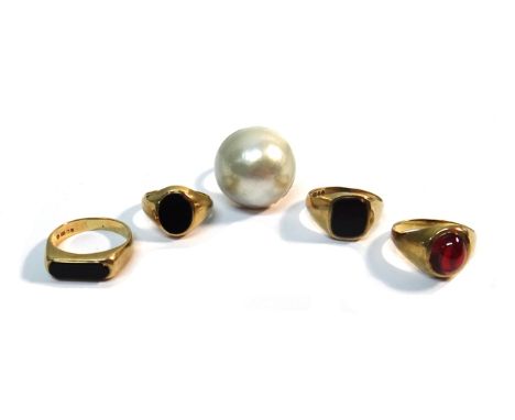 A 9ct gold ring, mounted with a large mabe pearl, a 9ct gold and carbuncle garnet set single stone ring and three 9ct gold an