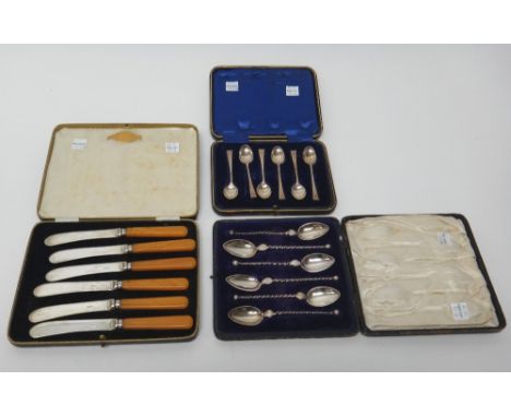 A set of six silver coffee spoons, Sheffield 1915, cased, a set of six Foreign coffee spoons, with spiral stems and with bead