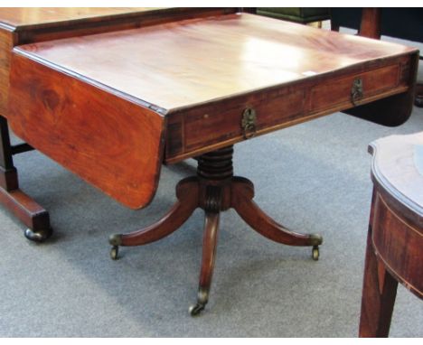 A Regency mahogany sofa table on turned column and four downswept supports, 91cm wide. 