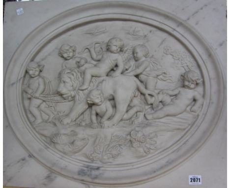 A modern faux marble plaque centred with relief moulded frolicking cherubs (61cm x 51cm), a pair of brass hurricane lamps wit