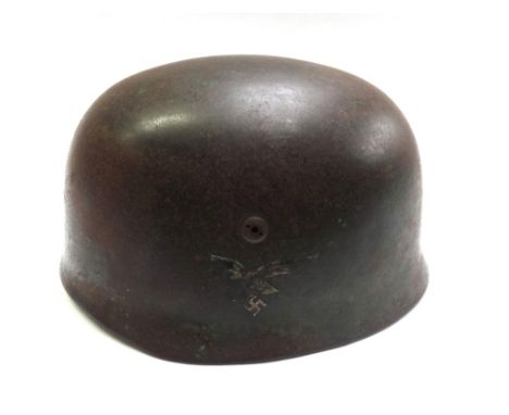 A German World War II paratrooper's helmet 1938, Luftwaffe with single decal and leather lining, impressed and printed marks,